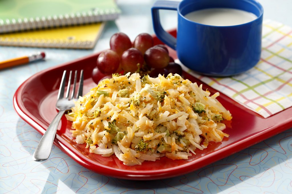 Broccoli & Cheese Hash Browns with grapes on a Tray with a Glass of Milk